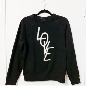 Black “love” crewneck sweater